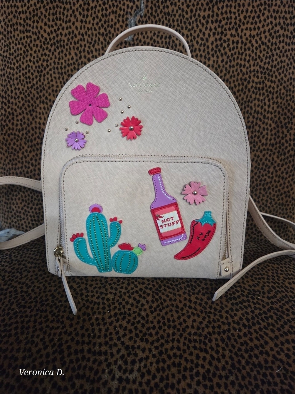 kate spade cream mini backpack with colorful floral and novelty patches